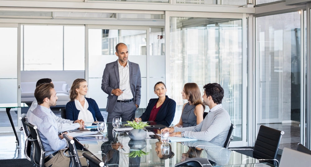 A group of people sitting around a table.